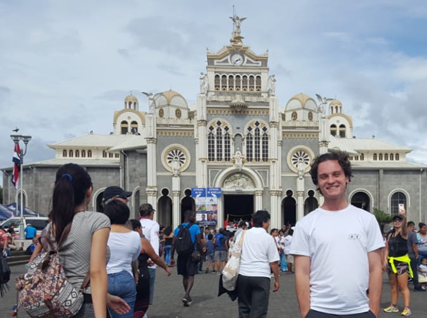 UA Study Abroad Student Brenden Barness in Costa Rica, Basilica square in background.