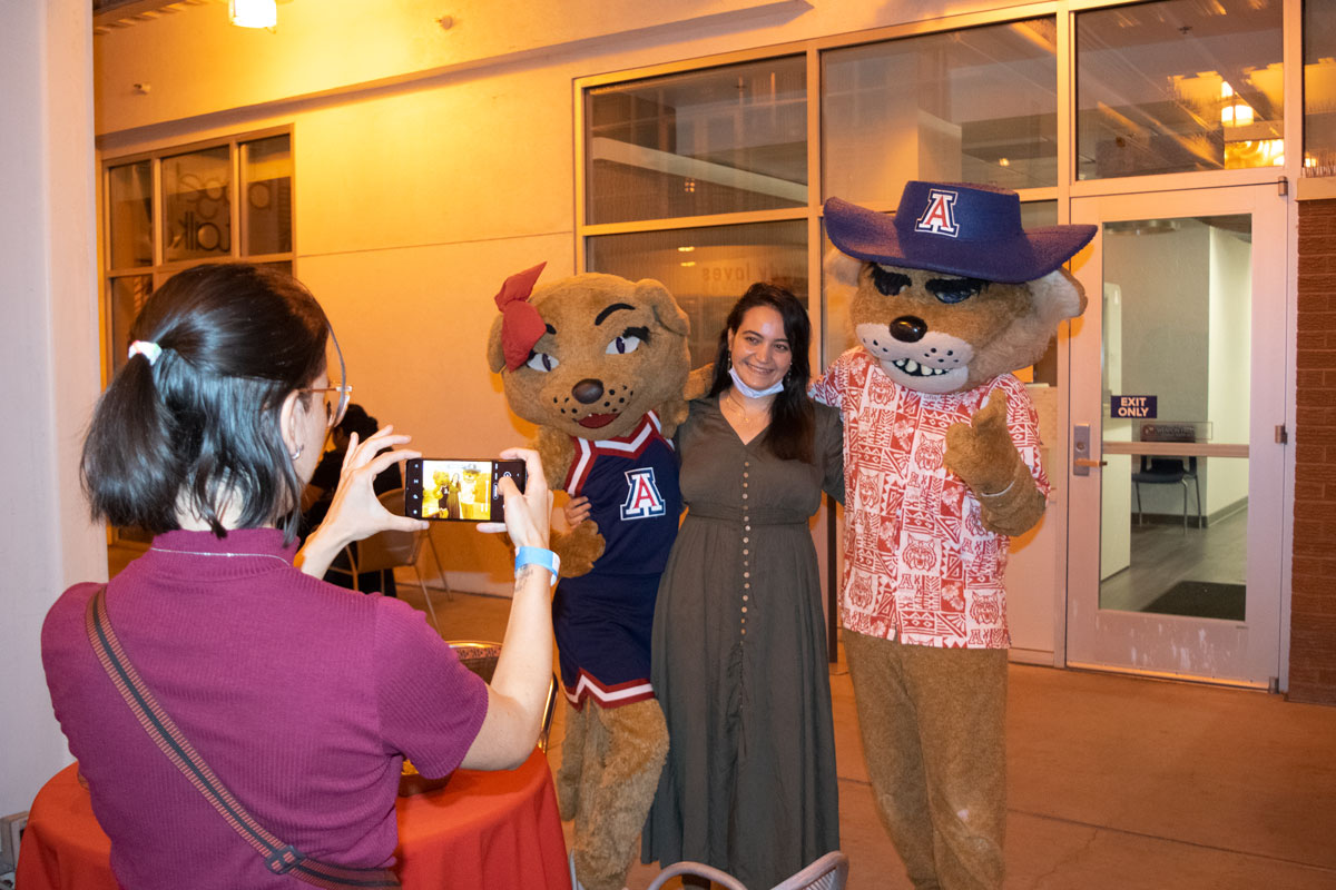 Party at Global Fall 2021 - Student getting photo taken with Wilbur Wildcat