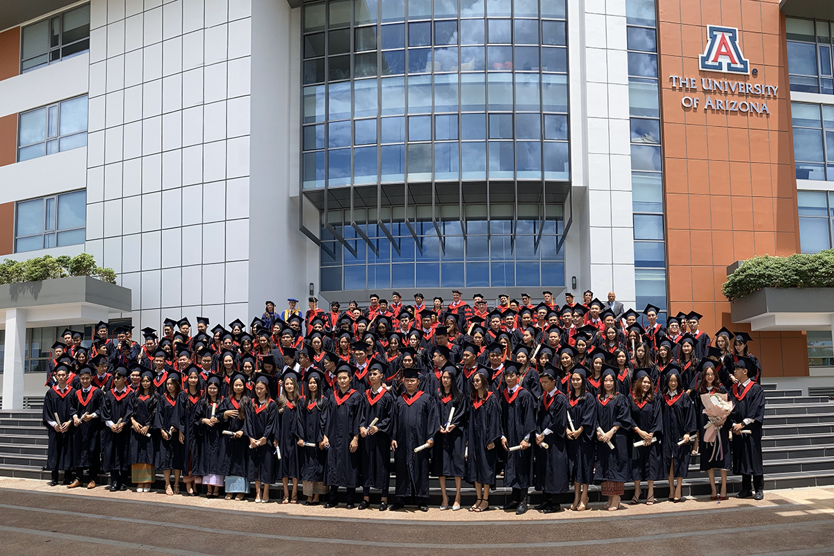 Very large group of graduates posing on steps at the UArizona AUPP Graduation Ceremony June 2022