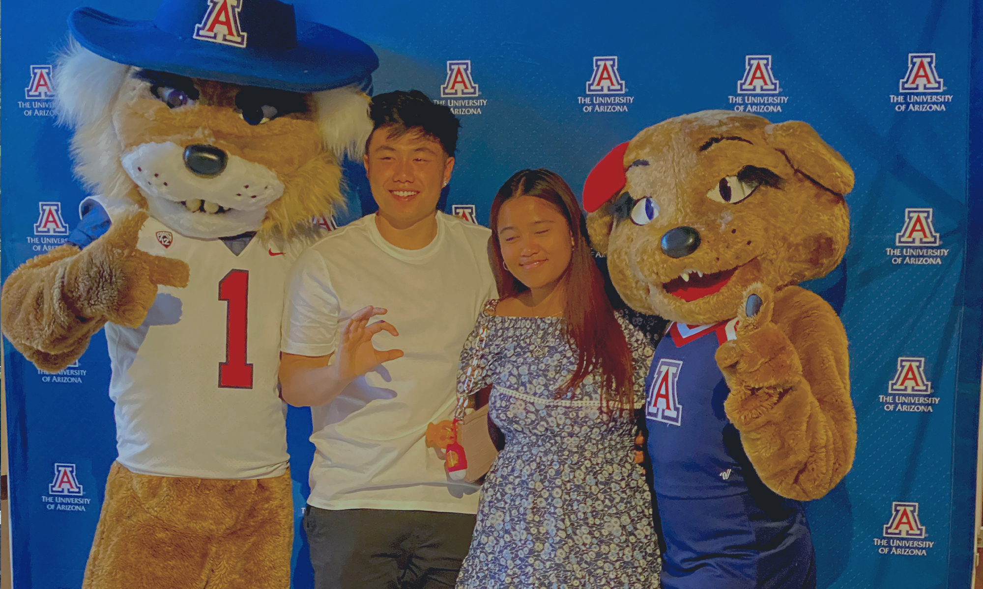 UArizona Intl Students Visitors Reception May 11, 2022 - male and female student w/Wilbur and Wilma