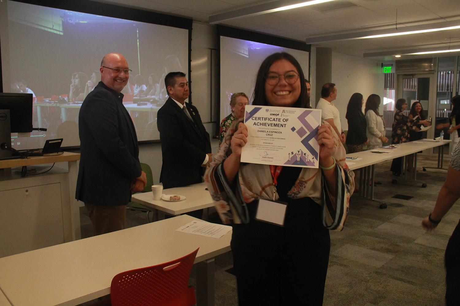 Women in STEM 2022 student receiving certificate of participation