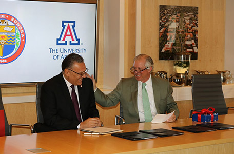 President Robbins Signs Agreement