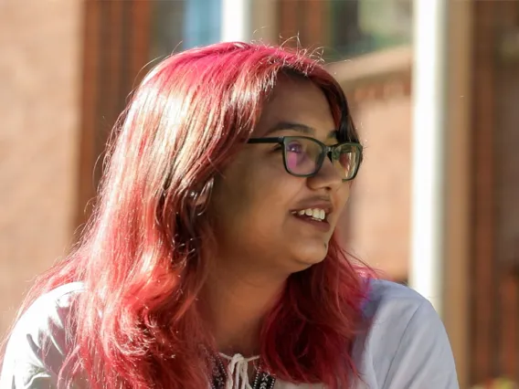 UArizona student Adiba sits outside