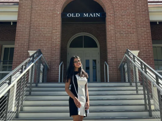 UArizona student Sameeka stands on the steps of Old Main