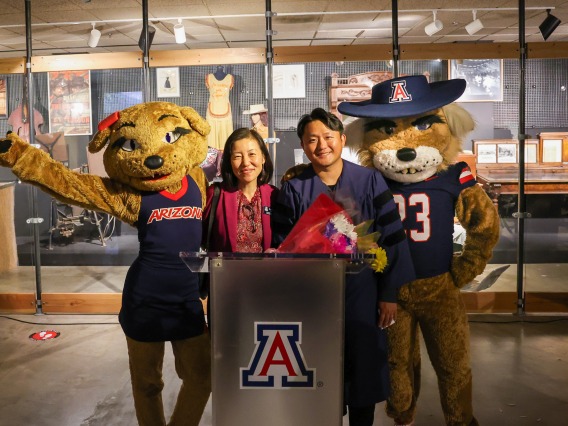 Wilma and Wilbur Wildcat mascots stand next to Dr. Jenny Lee and Dr. Hyeonchang “Kay” Gim 