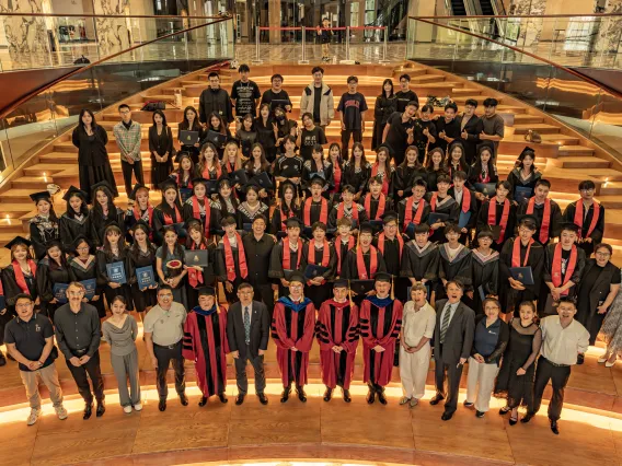 A large group photo of the dual degree graduates from Sias University