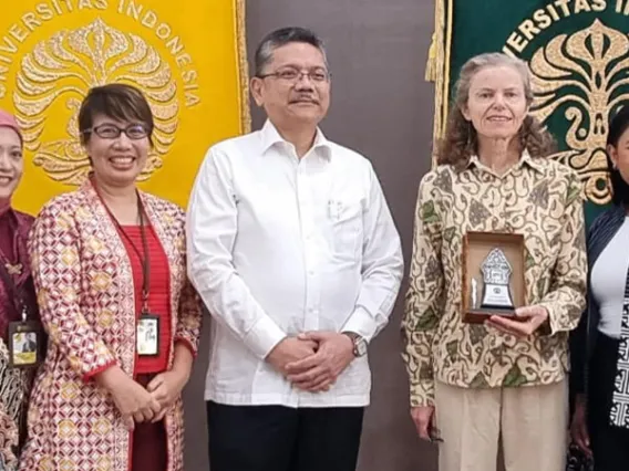 Mel and Enid Zuckerman College of Public Health representatives stand with partners from universities in Indonsia.