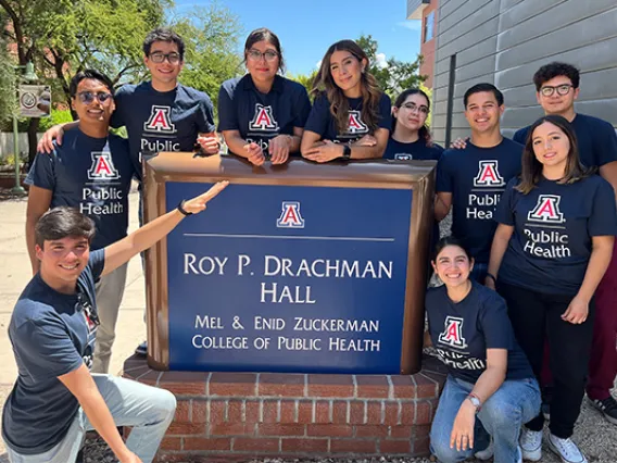 Students from the Universidad del Valle de México in front of Roy P. Drachman Hall sign