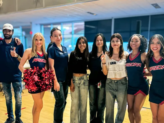 Global Ambassadors pose with U of A Cheerleaders