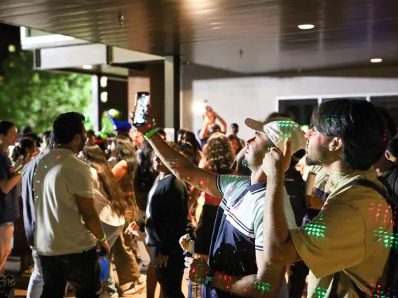 Students take a selfie on the dance floor.