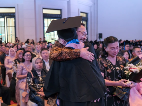 Parents congratulate their graduate.