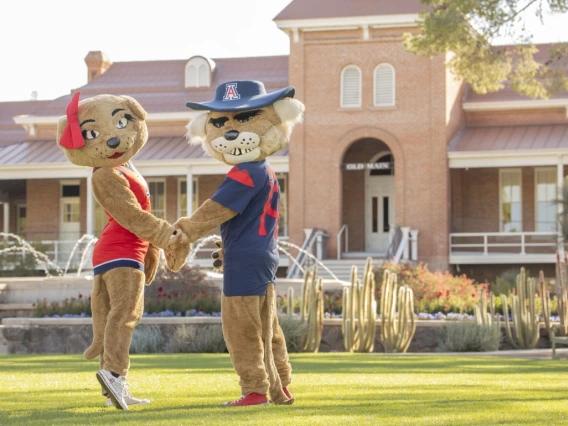 Wilbur and Wilma Wildcat in front of Old Main.