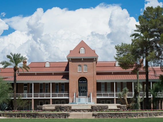 Old Main in front of a backdrop of clouds