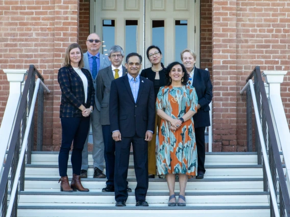 U of A and UNAM leaders stand in front of Old Main.