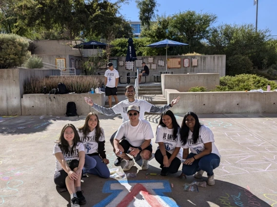 Shreyas with friends in a courtyard.