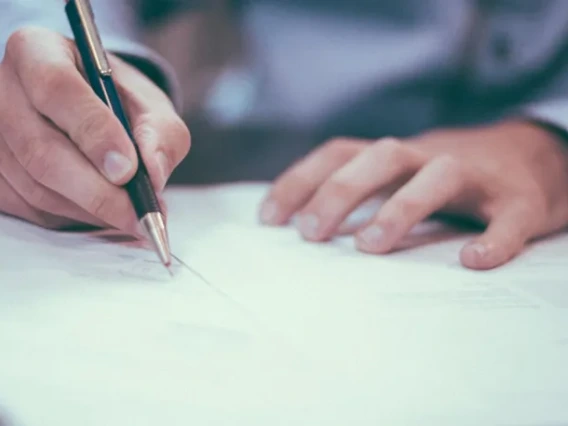 Man writing on a paper