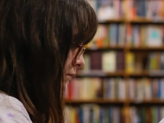 Woman reading in library