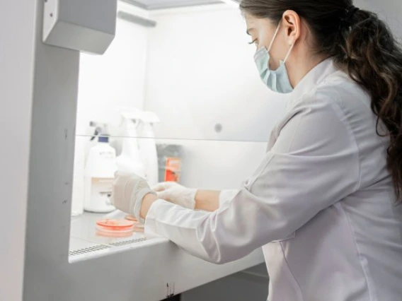 Student with a microscope