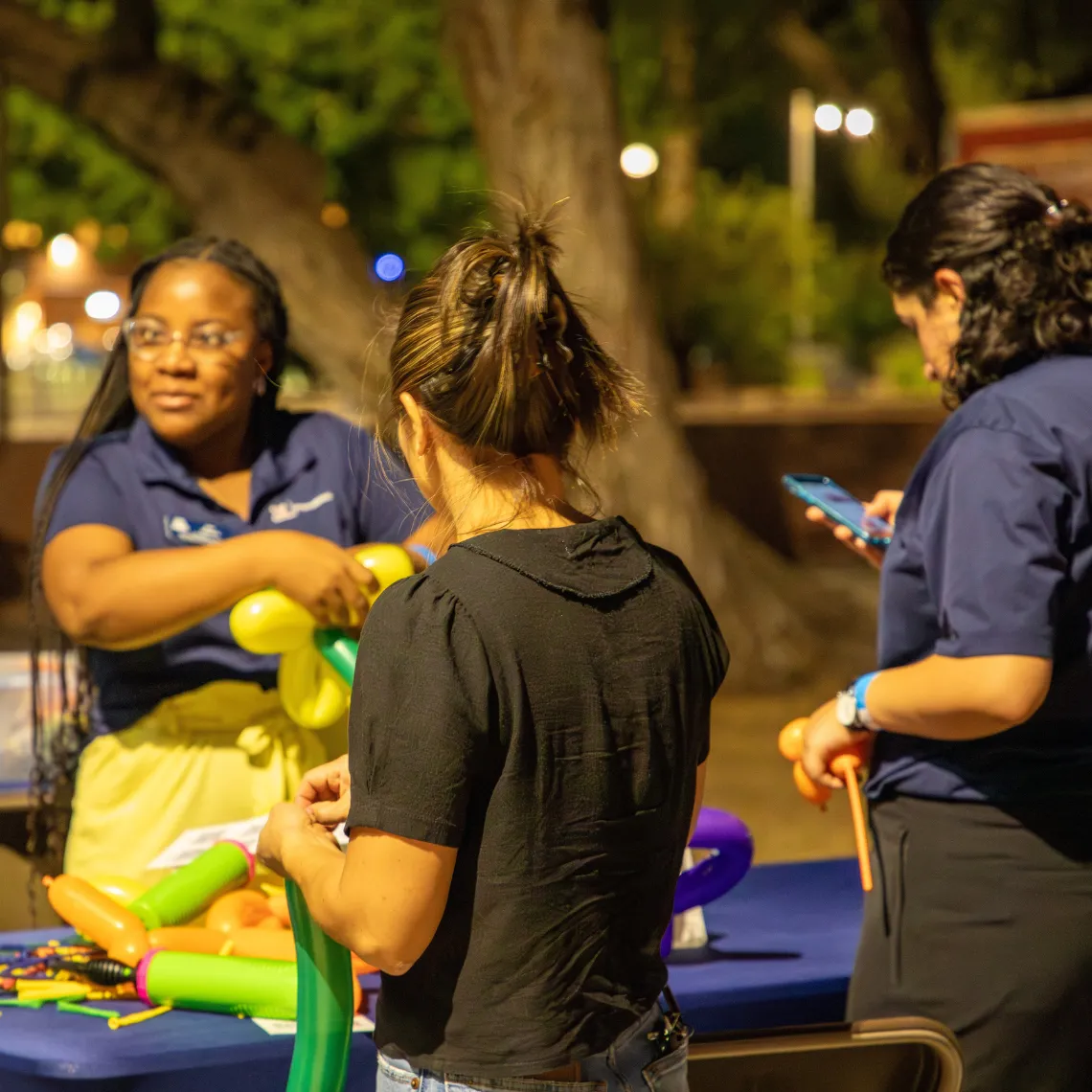 Students learn how to make balloon animals 