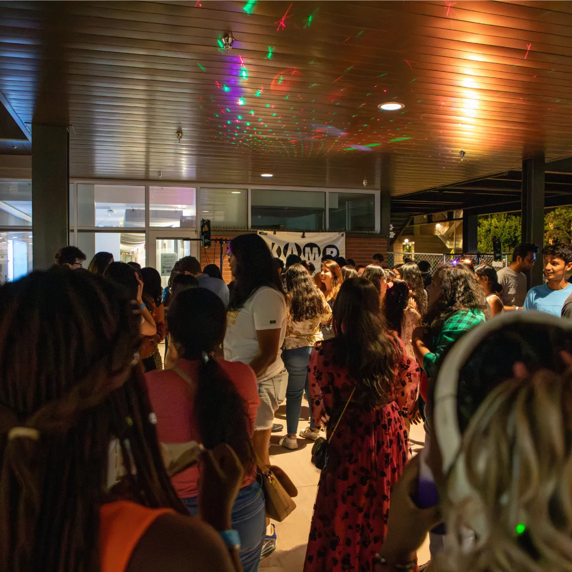 Students dancing in the Global Center patio