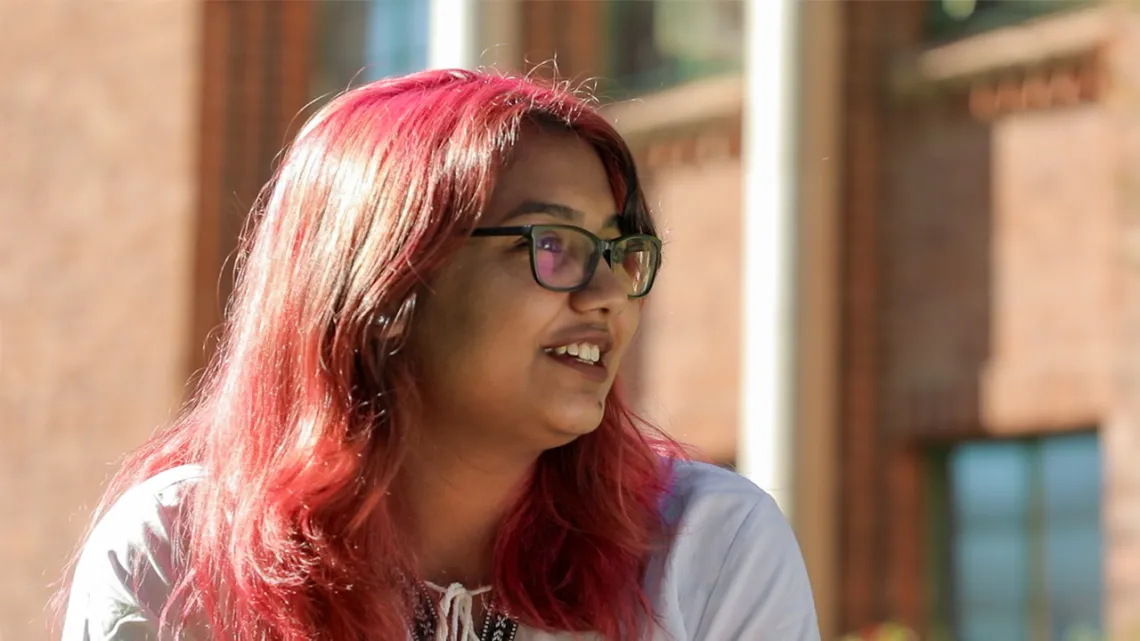 UArizona student Adiba sits outside