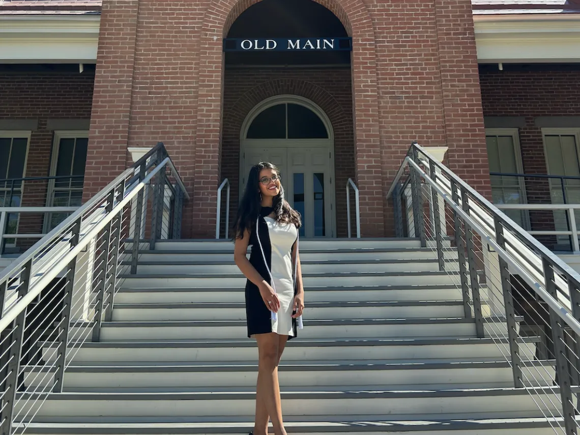 UArizona student Sameeka stands on the steps of Old Main