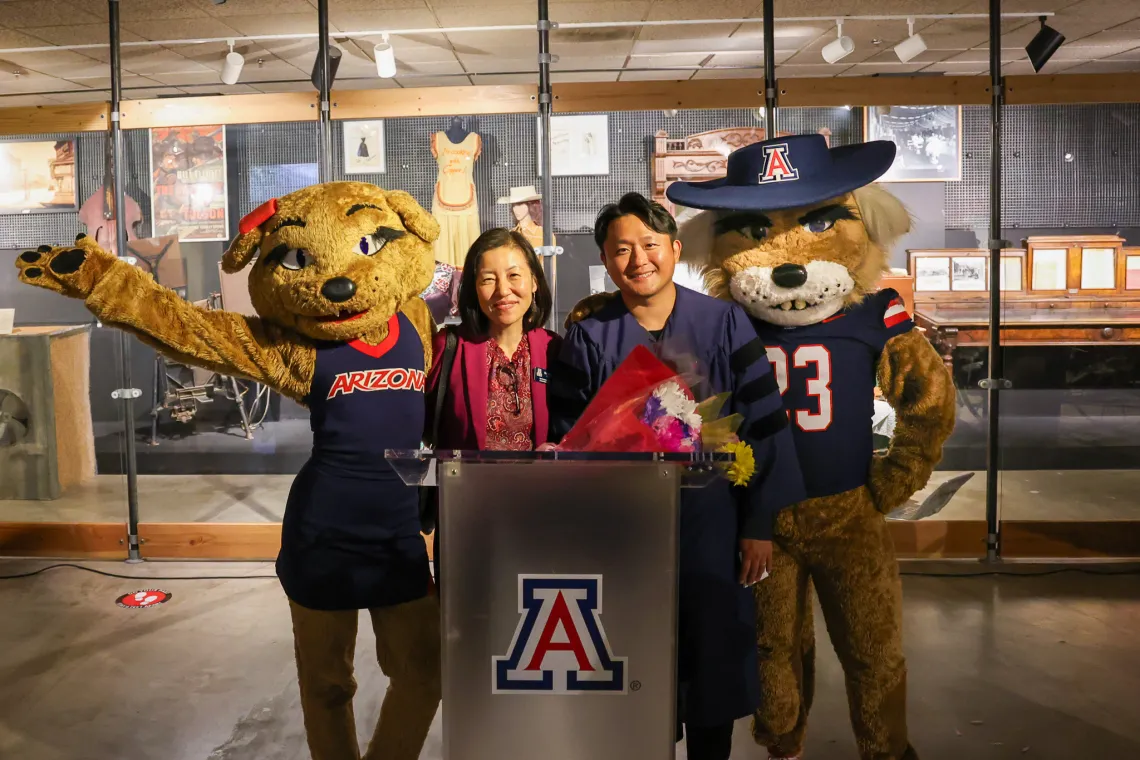 Wilma and Wilbur Wildcat mascots stand next to Dr. Jenny Lee and Dr. Hyeonchang “Kay” Gim 