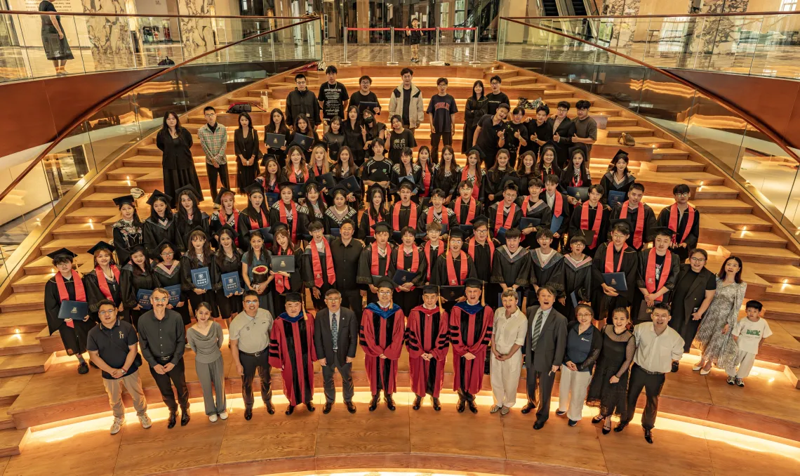 A large group photo of the dual degree graduates from Sias University