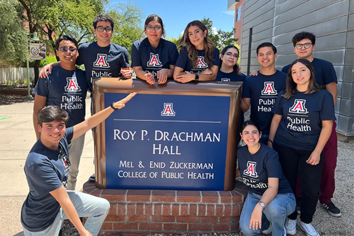 Students from the Universidad del Valle de México in front of Roy P. Drachman Hall sign