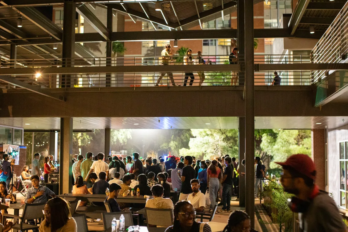 The Global Center patio filled with people sitting and eating.