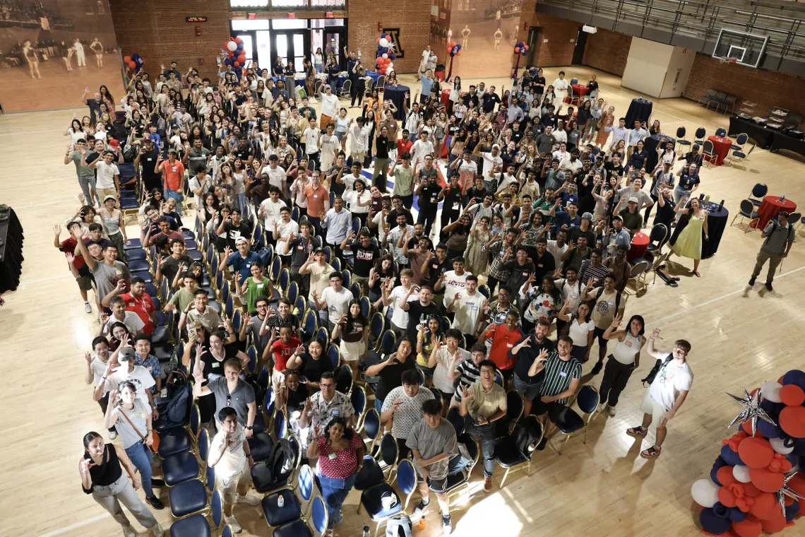 The large international student class poses for a group photo.