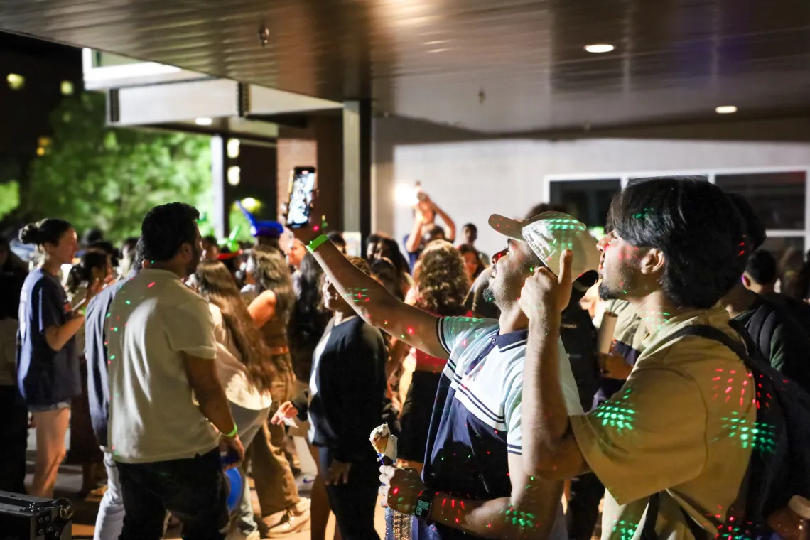 Students take a selfie on the dance floor.