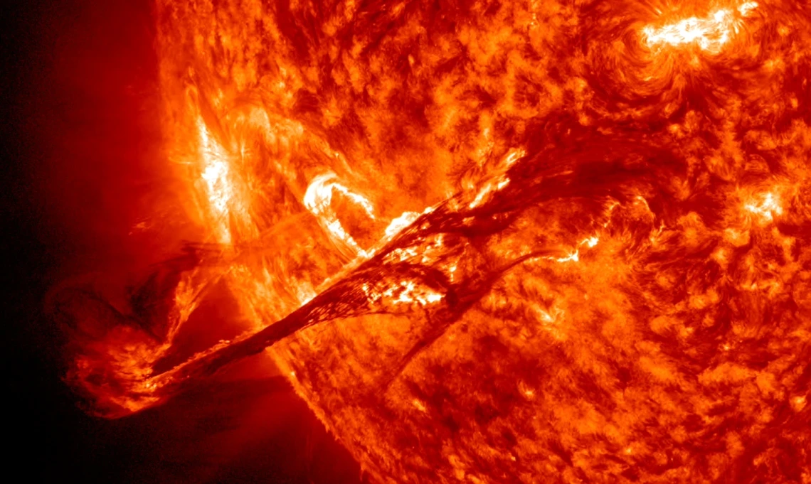 A solar flare erupts from the sun's surface