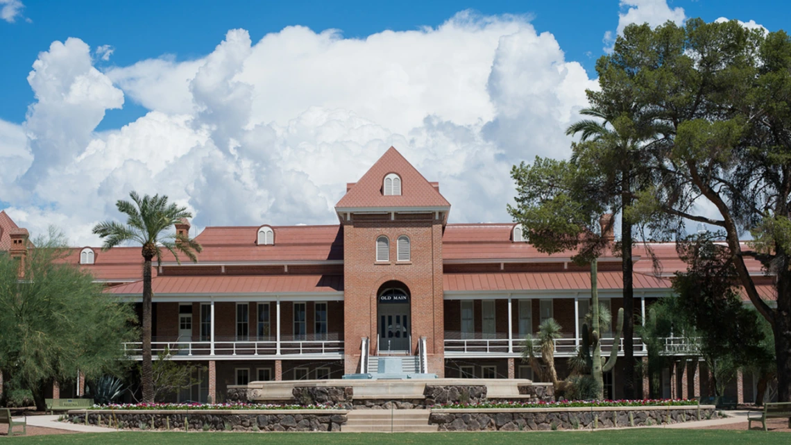 Old Main in front of a backdrop of clouds