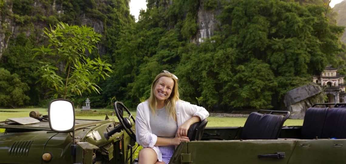 Kylie sits in a jeep in Ninh Binh, Vietnam