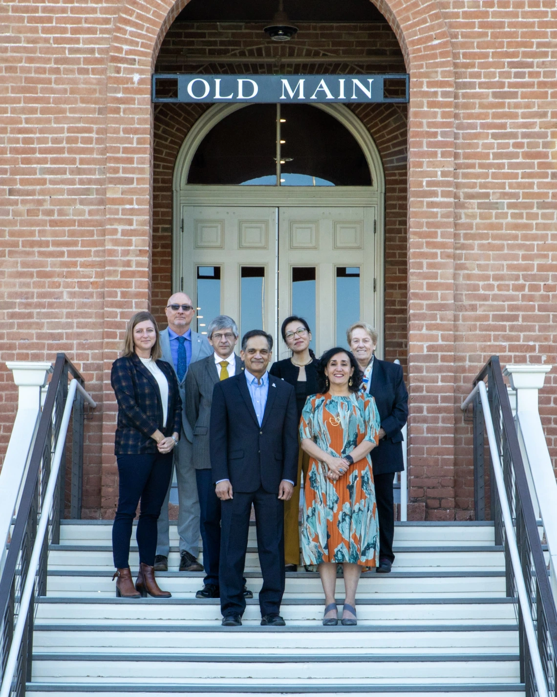 U of A and UNAM leaders stand in front of Old Main.