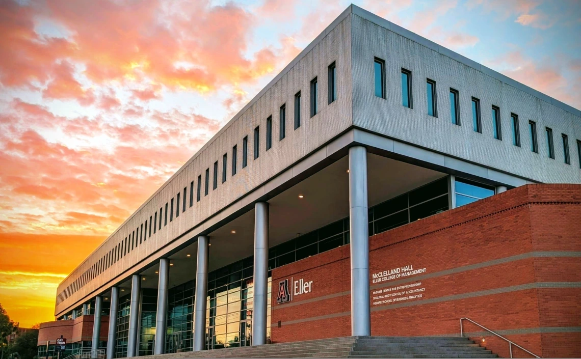 University of Arizona Eller College of Management building at dusk.