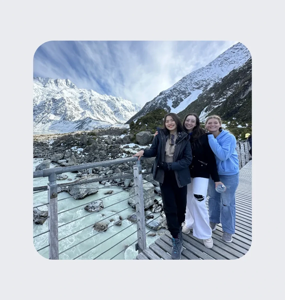 Three students in the mountains.