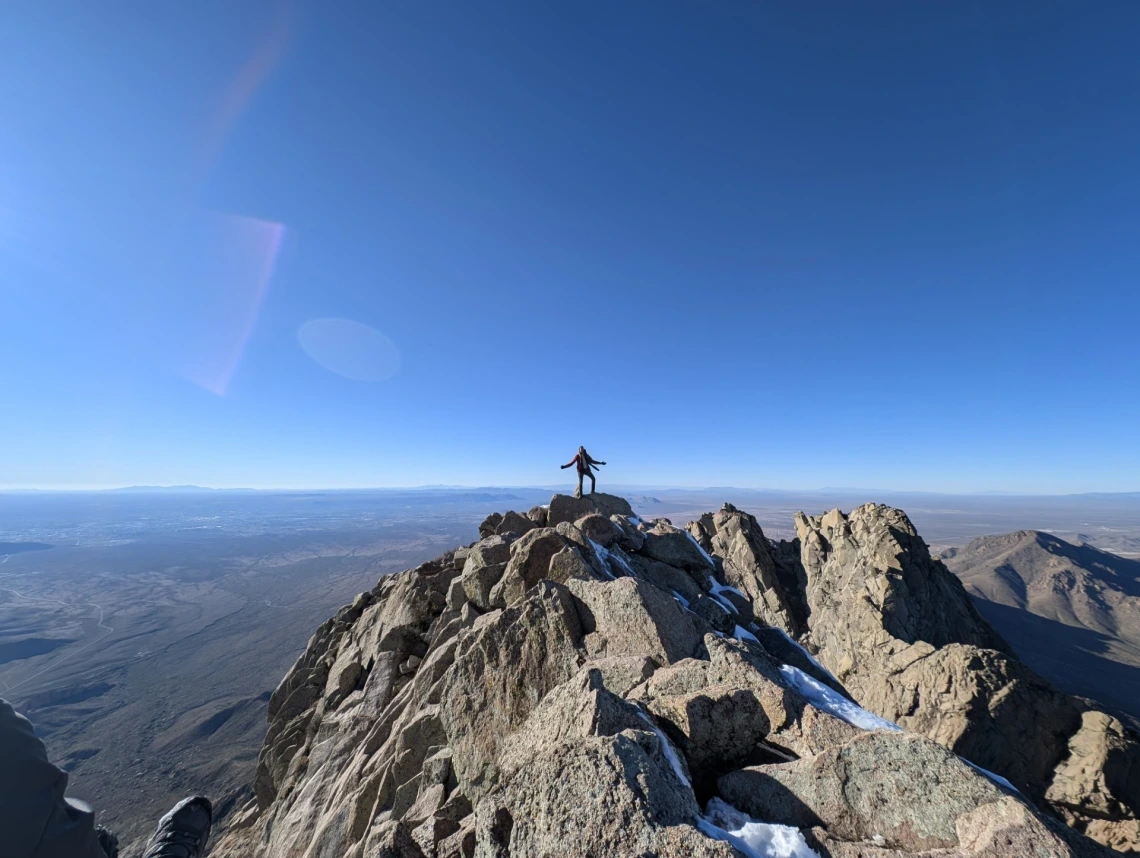 Shreyas on top of a mountain.