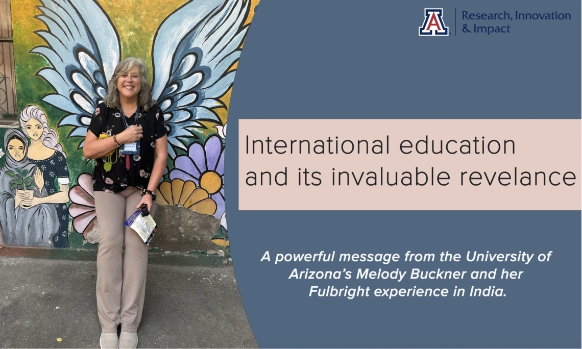 A smiling woman stands in front of a colorful mural featuring large angel wings and floral designs, creating the illusion that she has wings. She holds a pamphlet and wears a University of Arizona lanyard. To the right, a graphic overlay reads: “International education and its invaluable relevance” with a subheading, “A powerful message from the University of Arizona’s Melody Buckner and her Fulbright experience in India.” The design is branded with the U of A Research, Innovation & Impact logo, promoting g