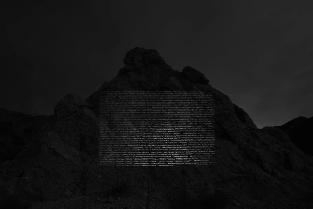 The names of the 411 victims of the 1928 St. Francis Dam Disaster projected on the St. Francis Dam ruins, San Francisquito Canyon.