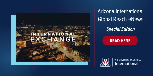 A promotional graphic for the Arizona International Global Reach eNews Special Edition. On the left, a nighttime cityscape image with the text “INTERNATIONAL EXCHANGE” is featured prominently. On the right, white text reads “Arizona International Global Reach eNews – Special Edition,” alongside a red button labeled “READ HERE.” The University of Arizona International logo appears at the bottom. The design uses dark blue, red, and light blue tones, emphasizing global engagement and outreach.