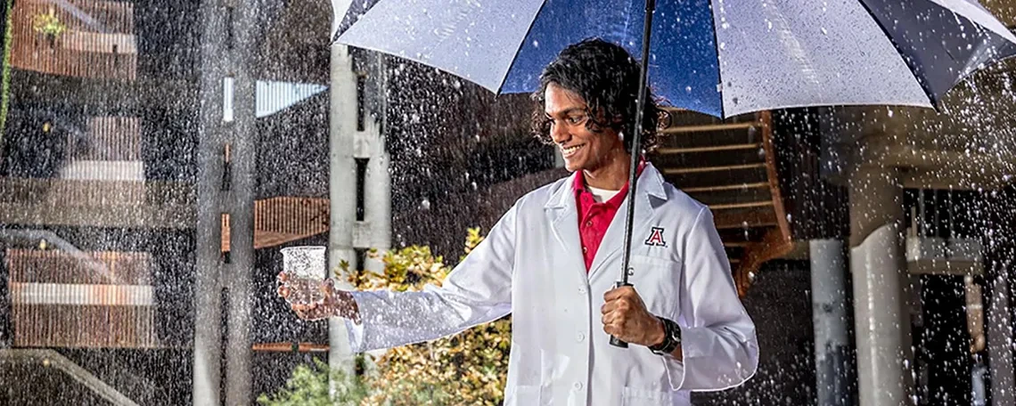 Scientist standing in the rain