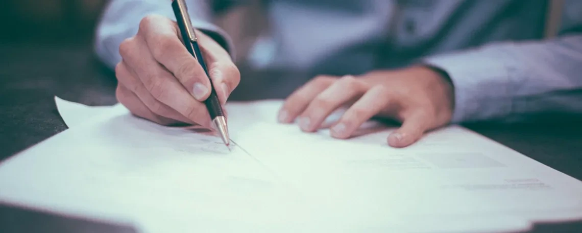 Man writing on a paper