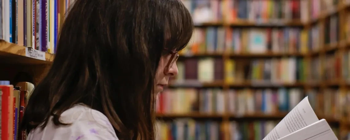 Woman reading in library