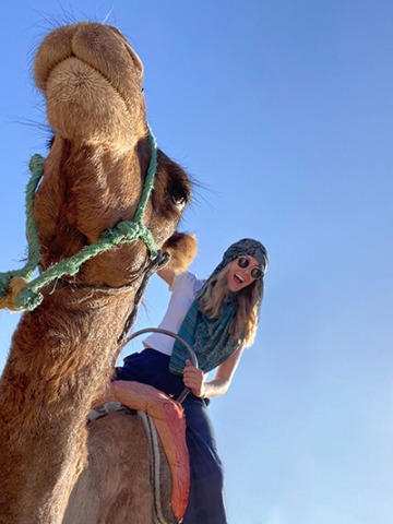 My Ride or Die - Image of student riding a camel