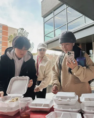 UArizona students grab some food at Friday @ Global