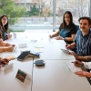 The Study Abroad team sits at a table signing thank you cards.