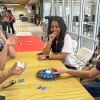 Students play a game around a table