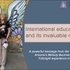 A smiling woman stands in front of a colorful mural featuring large angel wings and floral designs, creating the illusion that she has wings. She holds a pamphlet and wears a University of Arizona lanyard. To the right, a graphic overlay reads: “International education and its invaluable relevance” with a subheading, “A powerful message from the University of Arizona’s Melody Buckner and her Fulbright experience in India.” The design is branded with the U of A Research, Innovation & Impact logo, promoting g